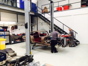classic car on hydraulic lift