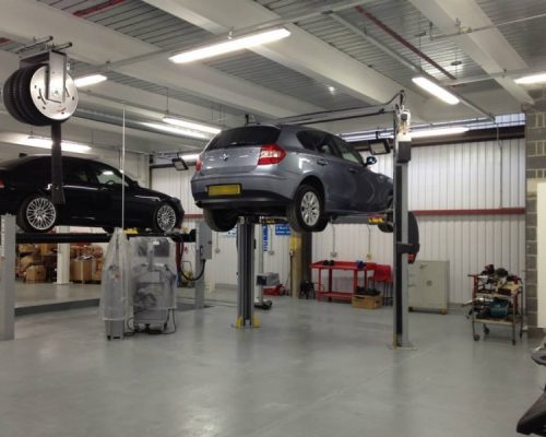 Cars on hydraulic lifts at Lambeth College