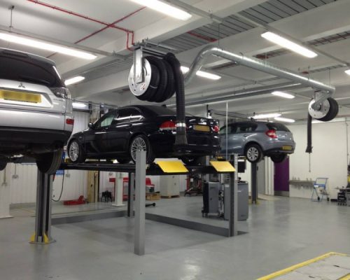 Cars on hydraulic lifts at Lambeth College