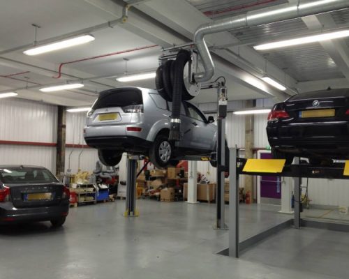 Cars on hydraulic lifts at Mercedes Shrewsbury