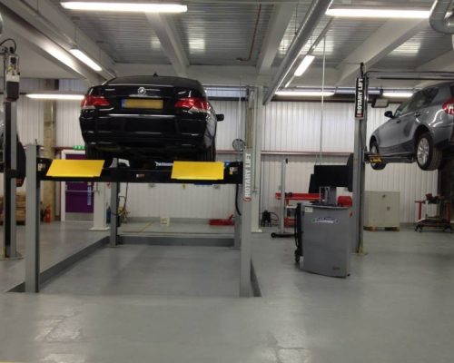 Cars on hydraulic lifts at Lambeth College
