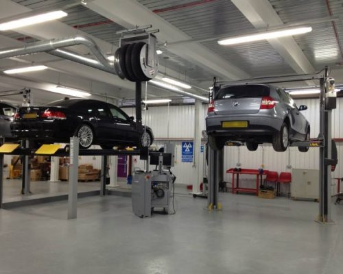 Cars on hydraulic lifts at Lambeth College