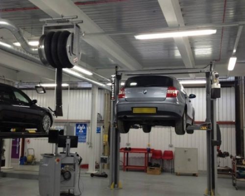 Cars on hydraulic lifts at Lambeth College